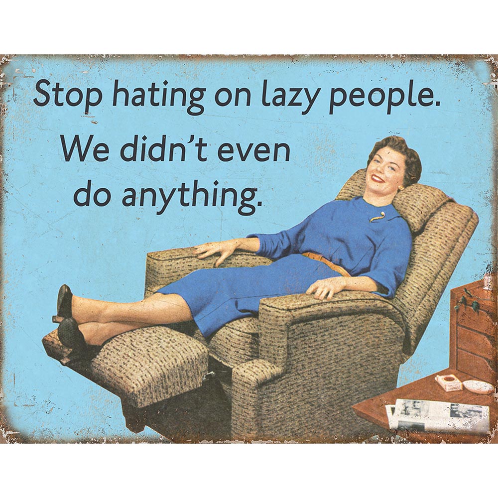Humorous sign featuring a woman lounging in a recliner with the text, "Stop hating on lazy people."