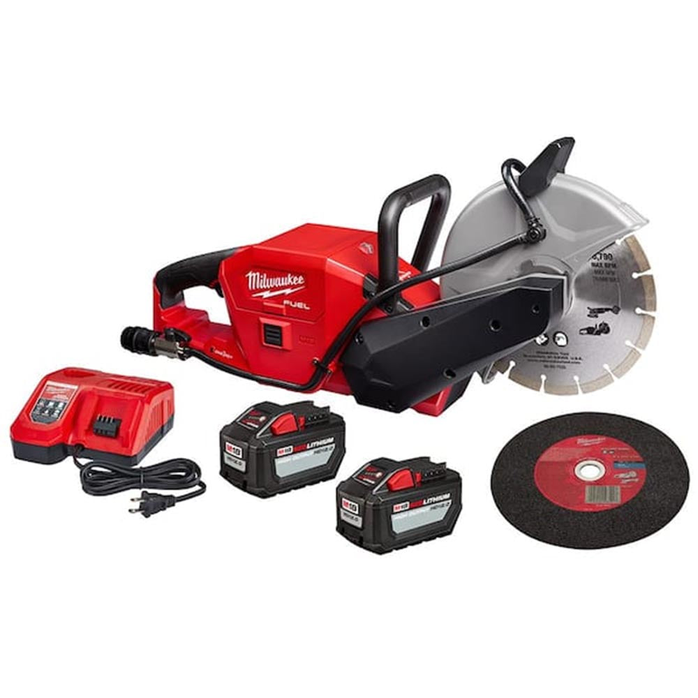 Red Milwaukee Fuel cut-off saw with a blade, charger, two batteries, and extra cutting wheel accessories.
