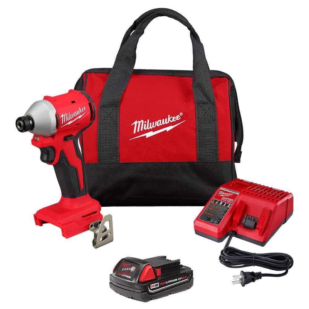 Milwaukee M18 impact driver kit with a compact driver, REDLITHIUM battery, charger, belt clip, and soft-sided tool bag.