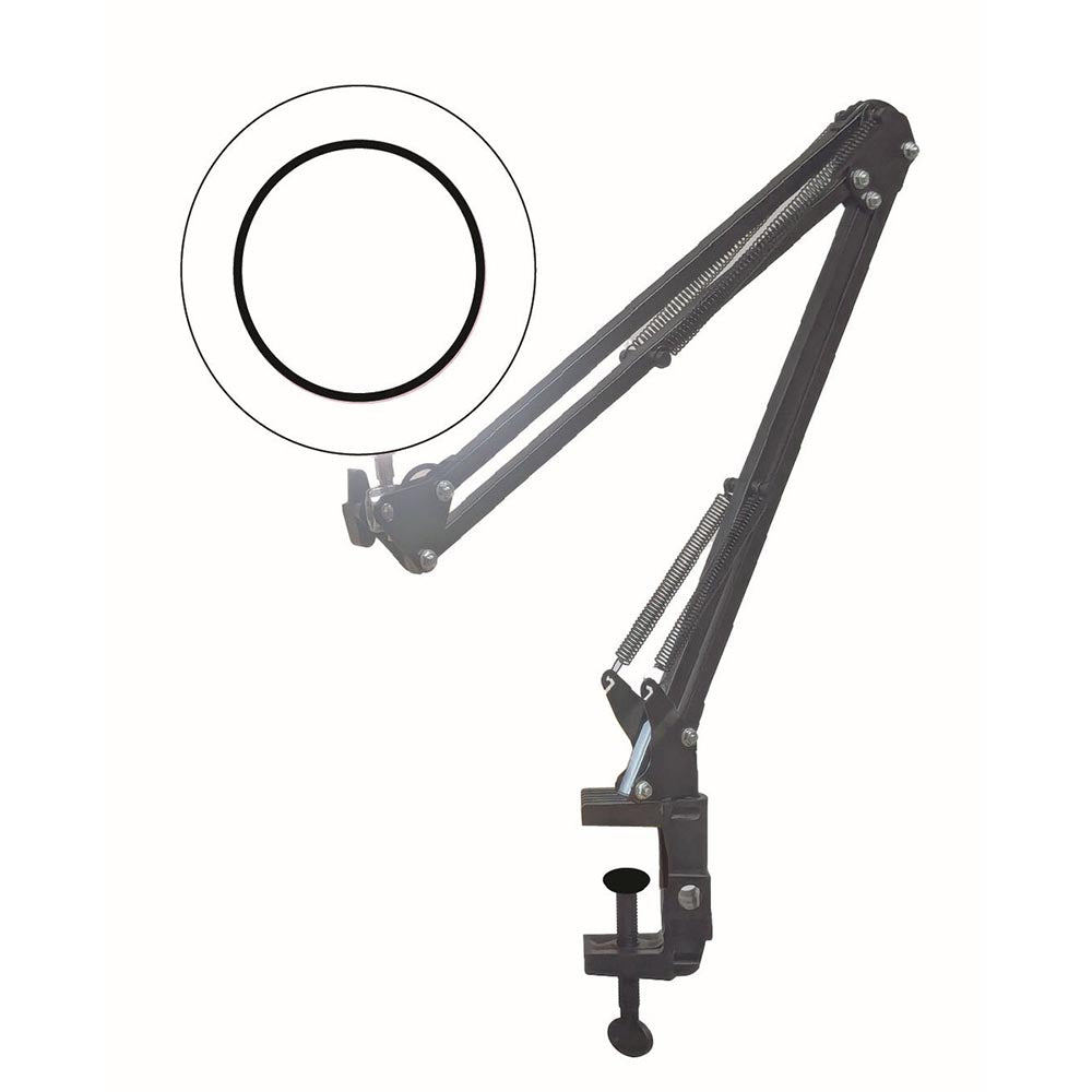 Adjustable scissor-arm mount with coiled tension springs and magnifier lamp attachment at the top end