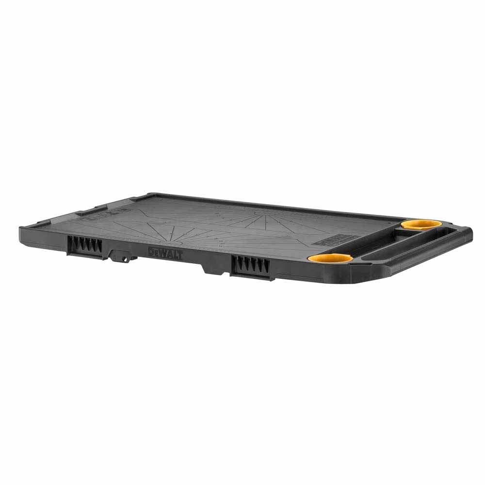 DeWalt ToughSystem worktop with a durable black surface, built-in handle, and yellow inserts for accessory placement.