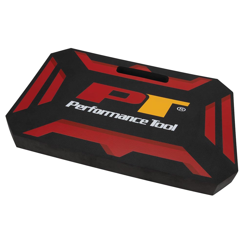 A durable foam kneeling pad in black with red and yellow details, branded with the Performance Tool logo, ideal for use in workshops and garages.