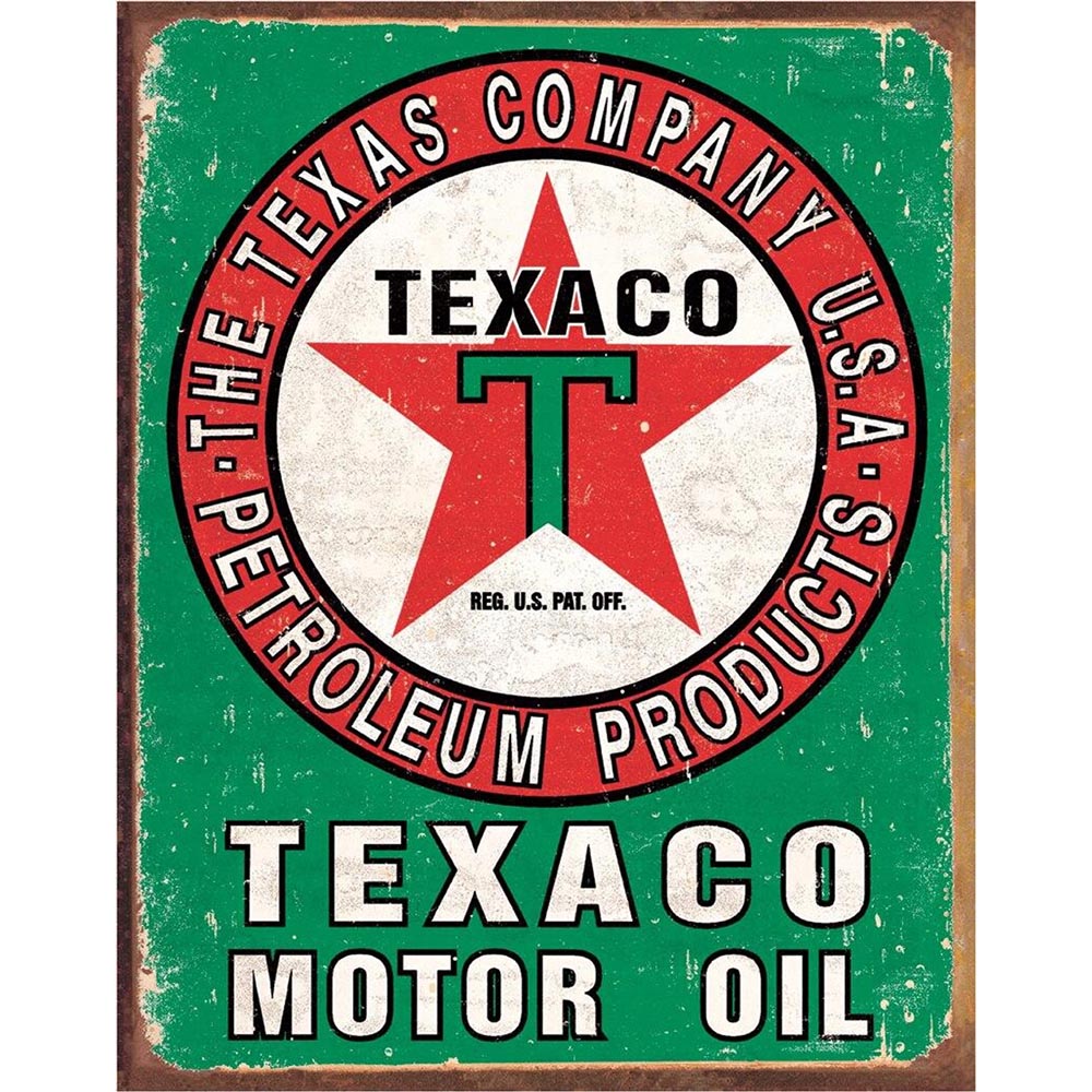 Rustic Texaco sign displaying the classic red star logo and bold lettering, framed by a green and red border.