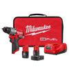 Milwaukee M12 Fuel drill kit with a compact drill, two lithium-ion batteries, a charger, and a red carrying case.