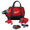 Milwaukee M18 drill driver kit with a compact drill, REDLITHIUM battery, charger, belt clip, and soft-sided tool bag.