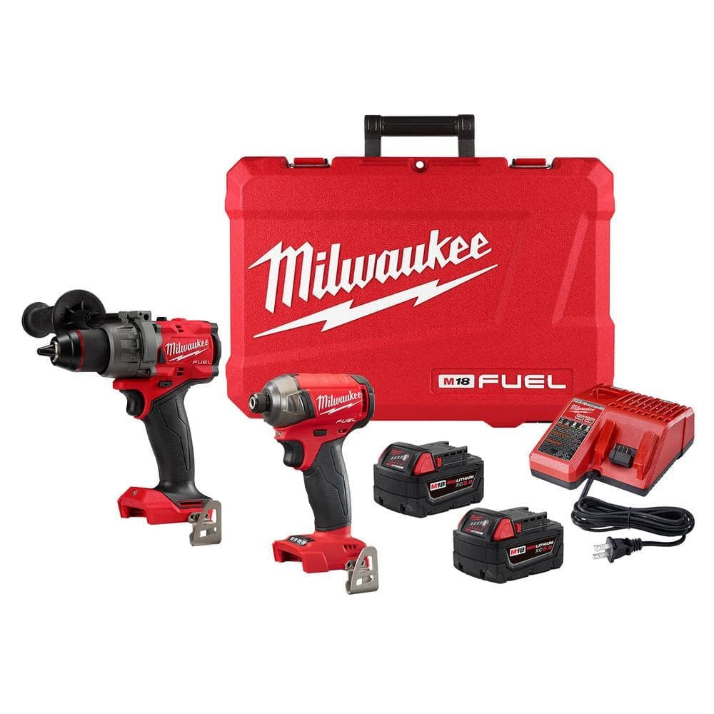 Milwaukee M18 Fuel cordless combo kit with hammer drill, impact driver, two batteries, charger, and hard carrying case for comprehensive tool needs.