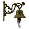 Ornate wall-mounted bell with a textured surface and decorative scrollwork bracket, featuring a rope pull.