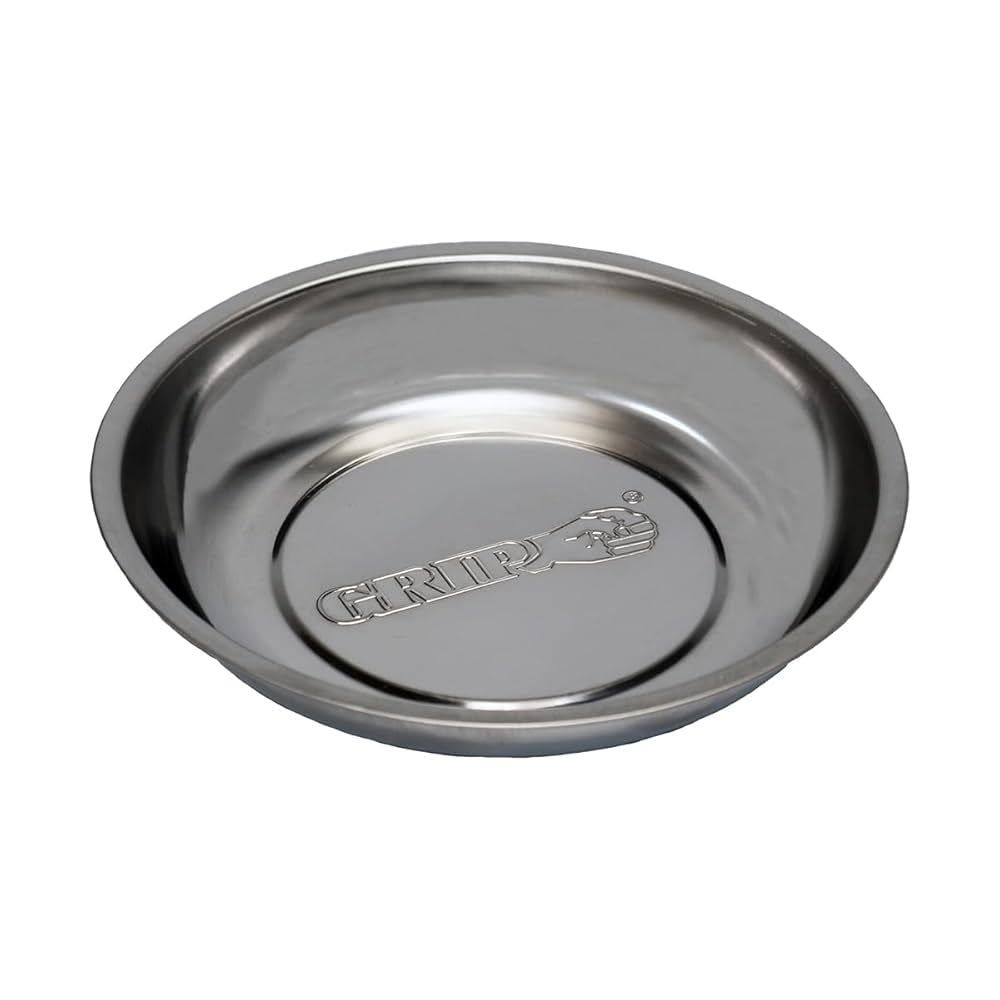 Shallow round metal tray with raised edges, polished finish, and embossed GRIP logo in the center