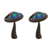 Pair of mushroom-shaped figures with rounded caps and scattered glowing oval inlays on each top